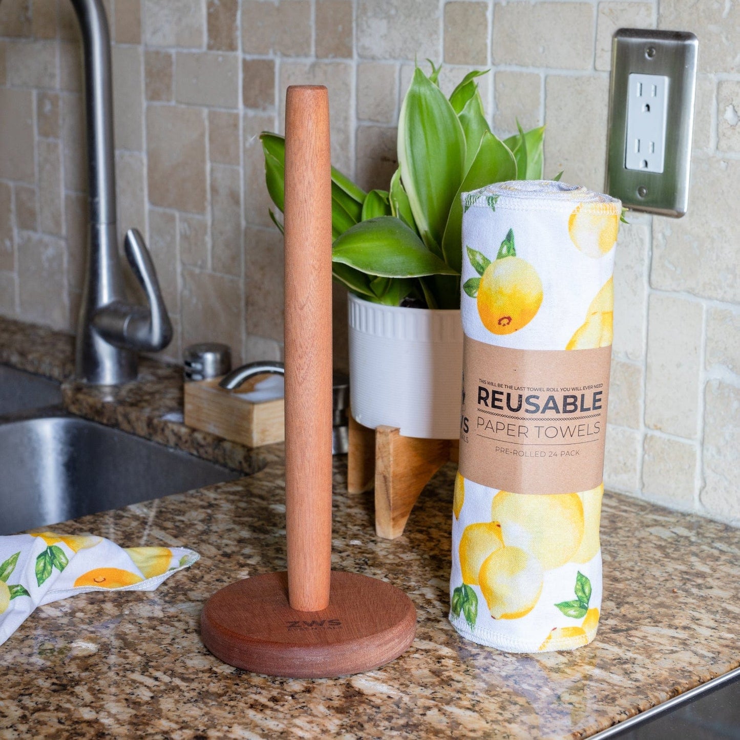 Wooden paper towel holder from ZeroWasteStore.com with a natural finish, designed to hold standard paper towels in a rustic style.